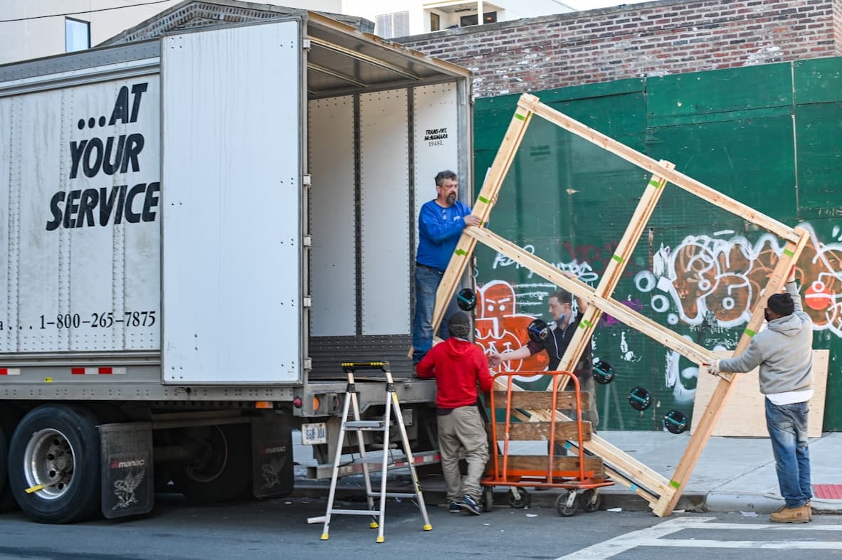 Guarented delivery team unloading furniture